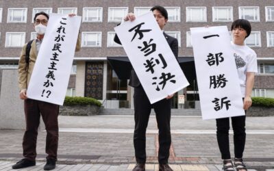 Court partly overturns damages for hecklers removed from Abe speech