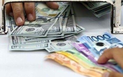 Peso nearly hits 57:$1